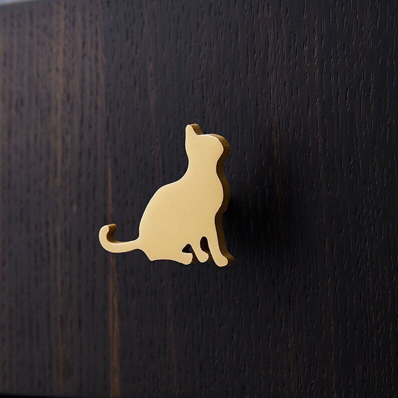 Cat Iron Knobs, Face To Left, Brass Finish - www.Shopthatapp.com