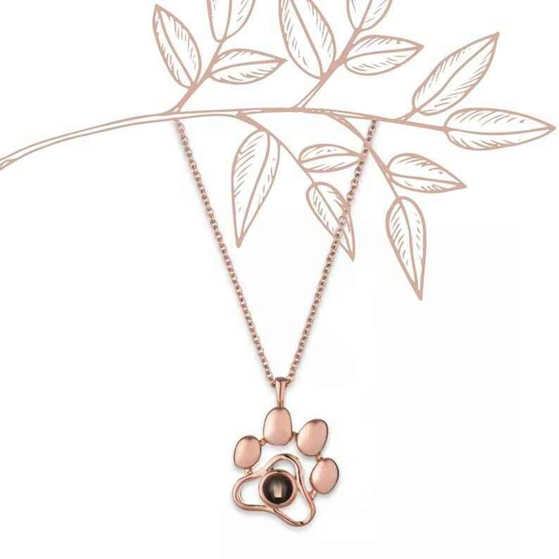 Custom pet photo necklace with a paw print design in rose gold, perfect for pet lovers