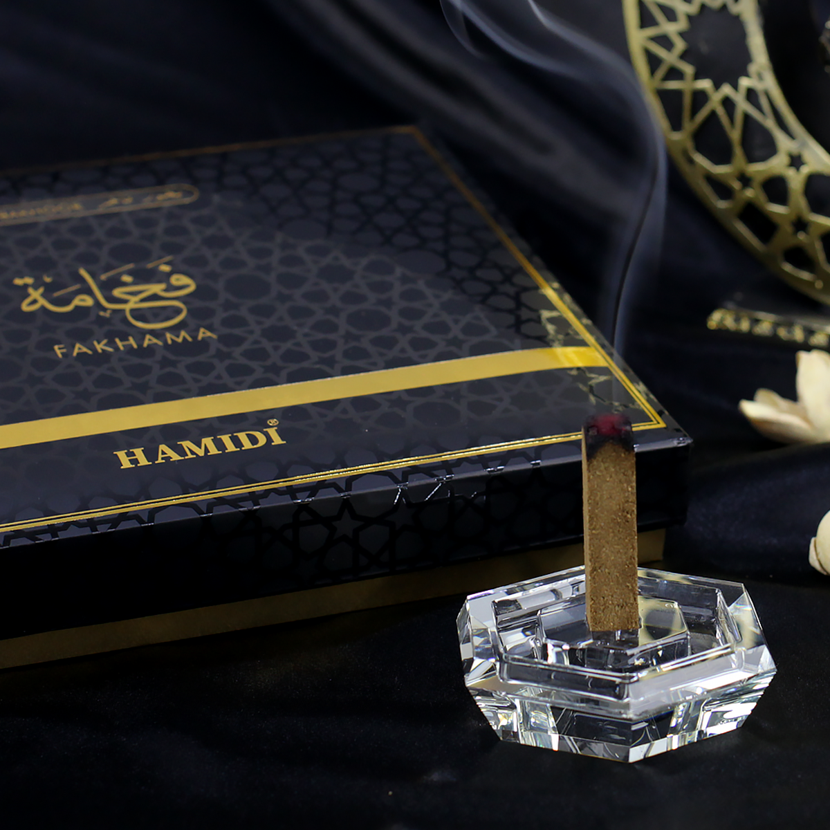 Fakhama Oud Sticks Canada displayed with crystal holder and smoke for an aromatic experience