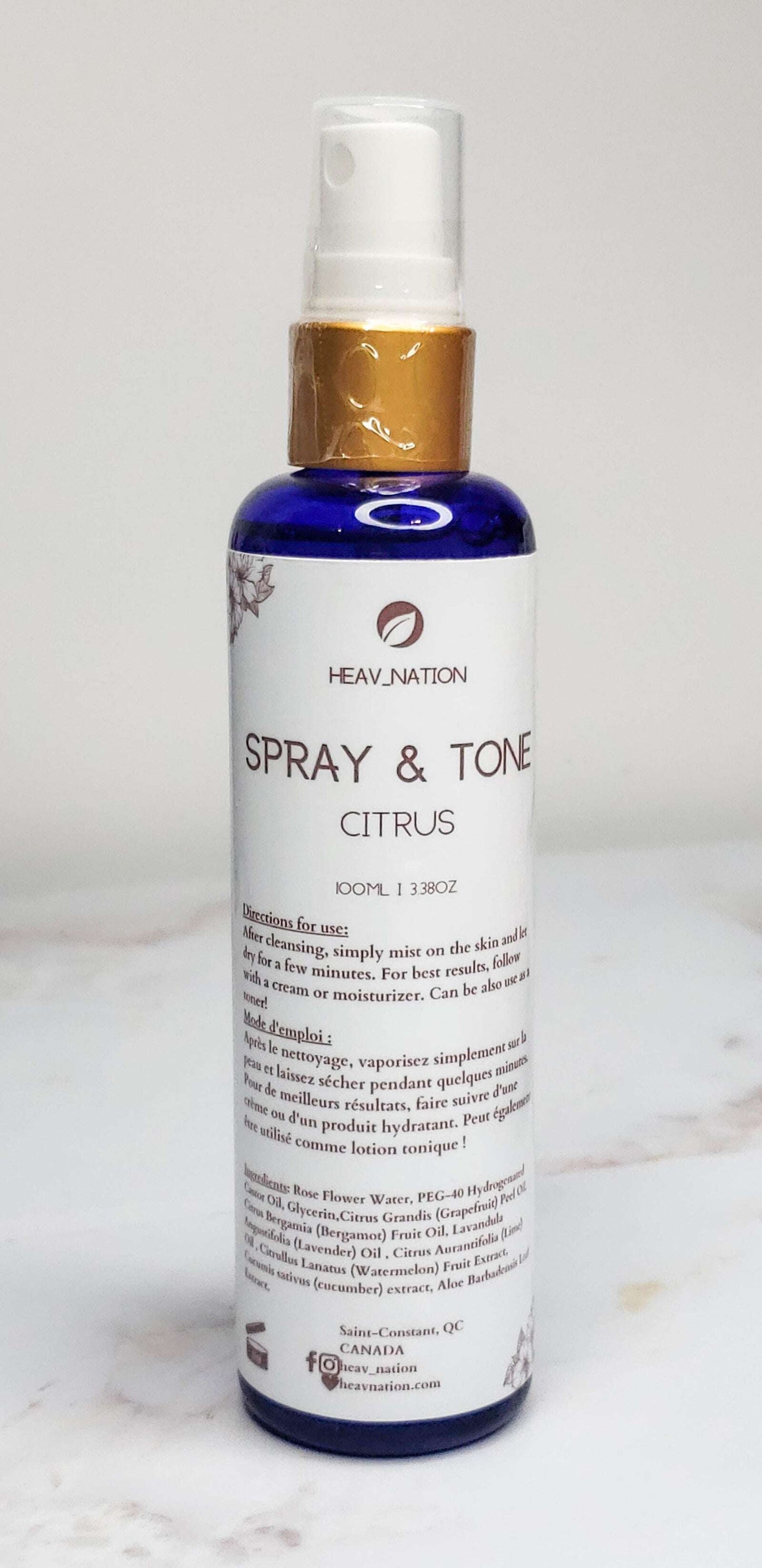 Heav Nation Citrus Body Spray in a blue bottle for refreshing skin hydration and fragrance