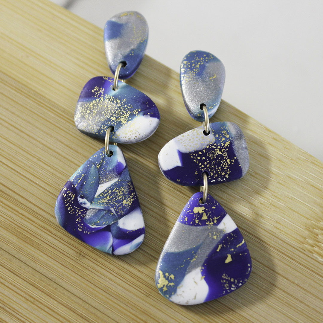 Alma Rosa polymer clay stone earrings in blue and gold with unique geometric design