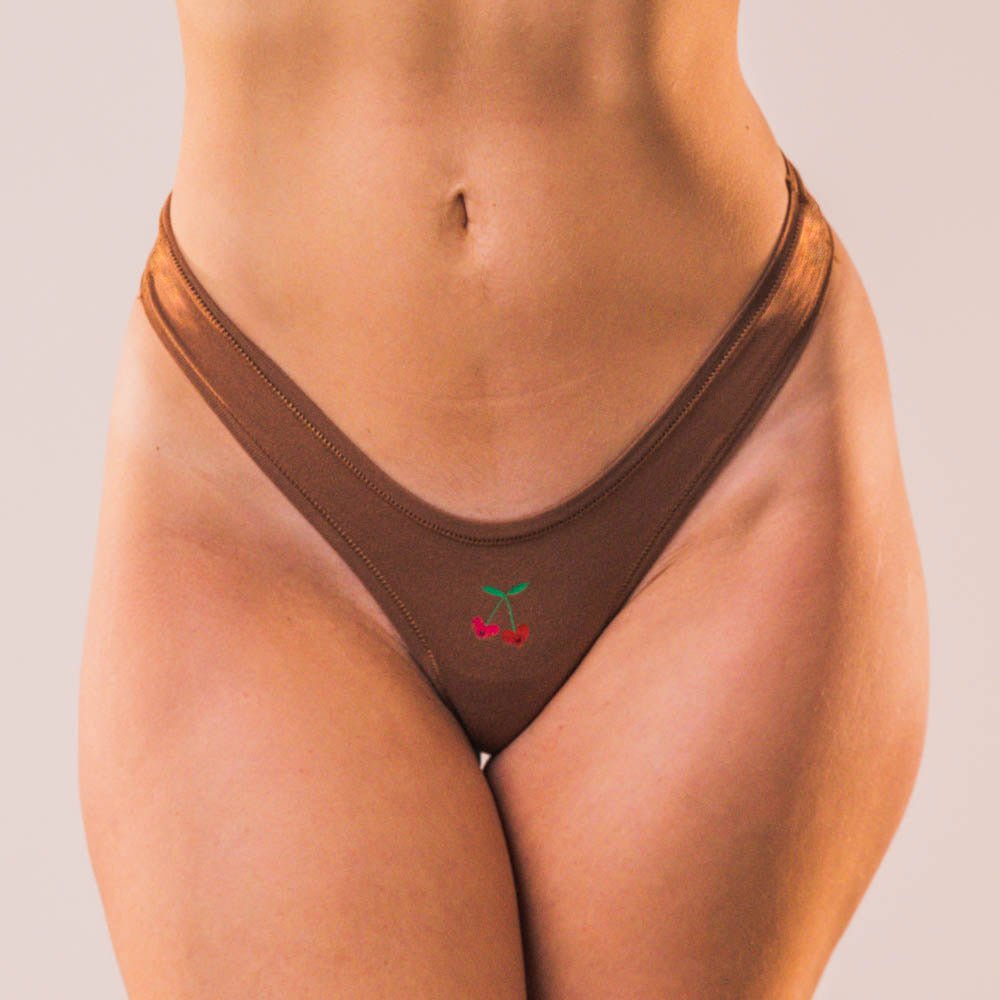 Cheeky Cherry leakproof thong liner in brown with cherry embroidery for everyday comfort