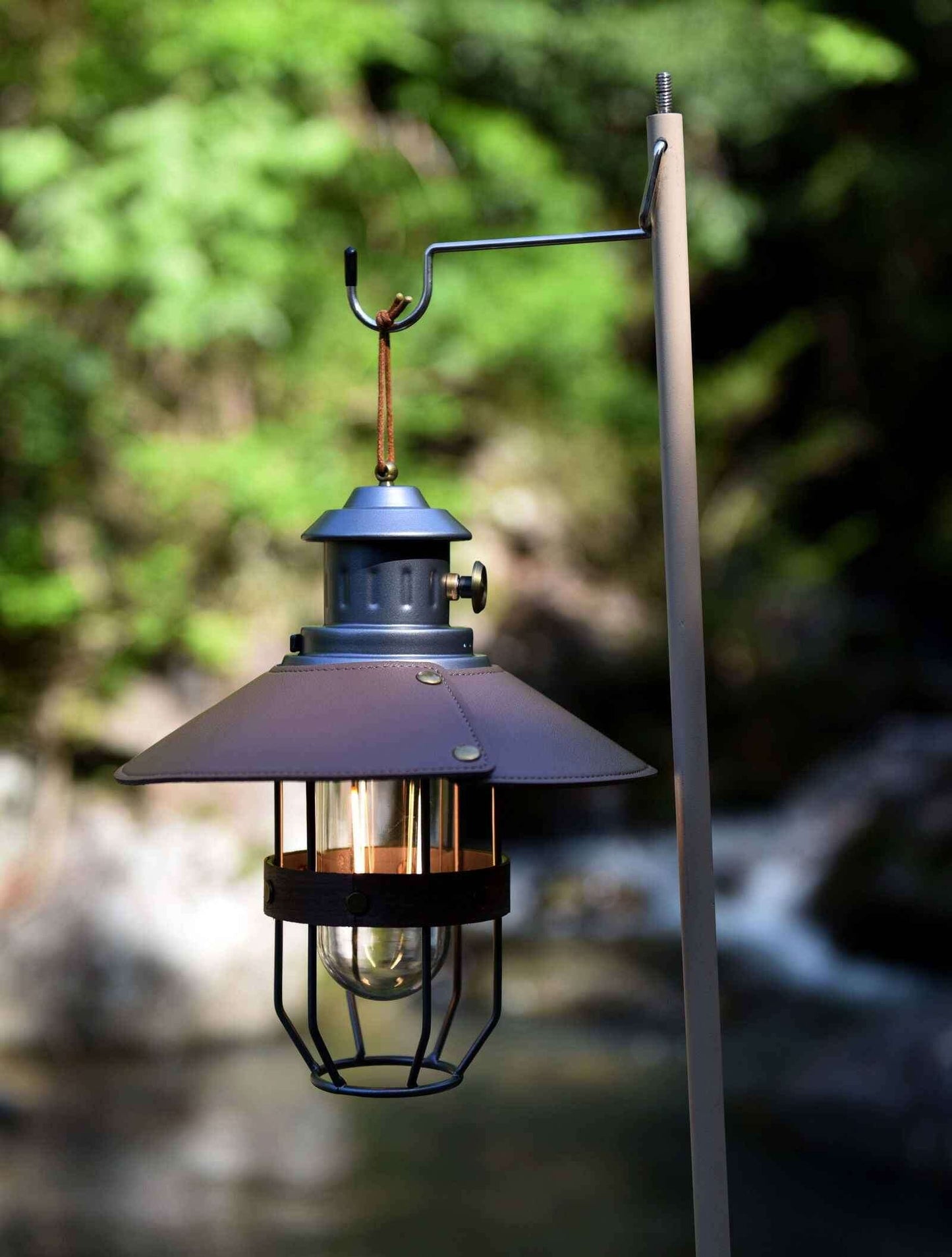 Vintage grey camping lantern with a rustic design, perfect for outdoor adventures and ambiance