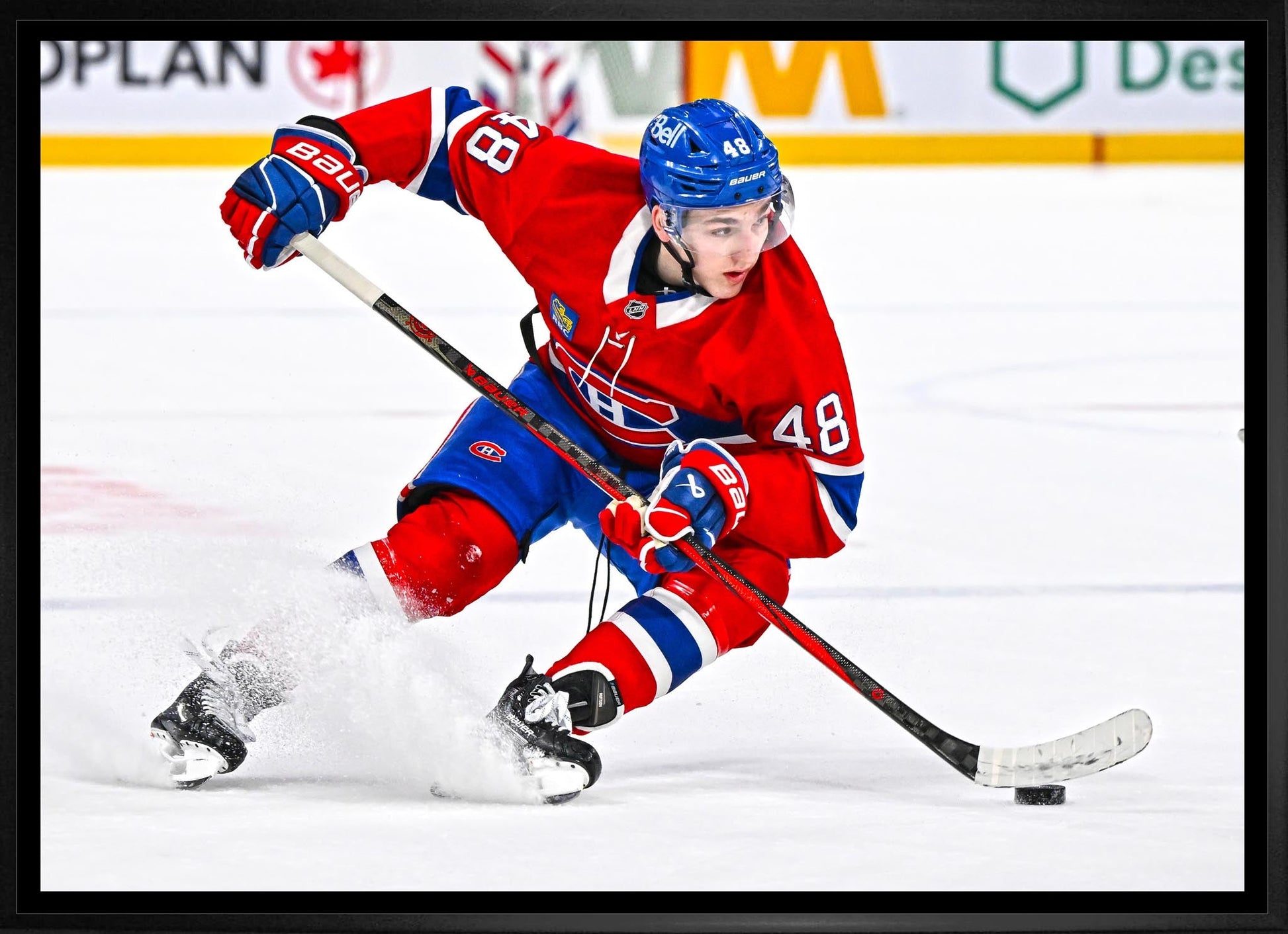 Lane Hutson 20x29 Framed Canvas Montreal Canadiens - www.Shopthatapp.com