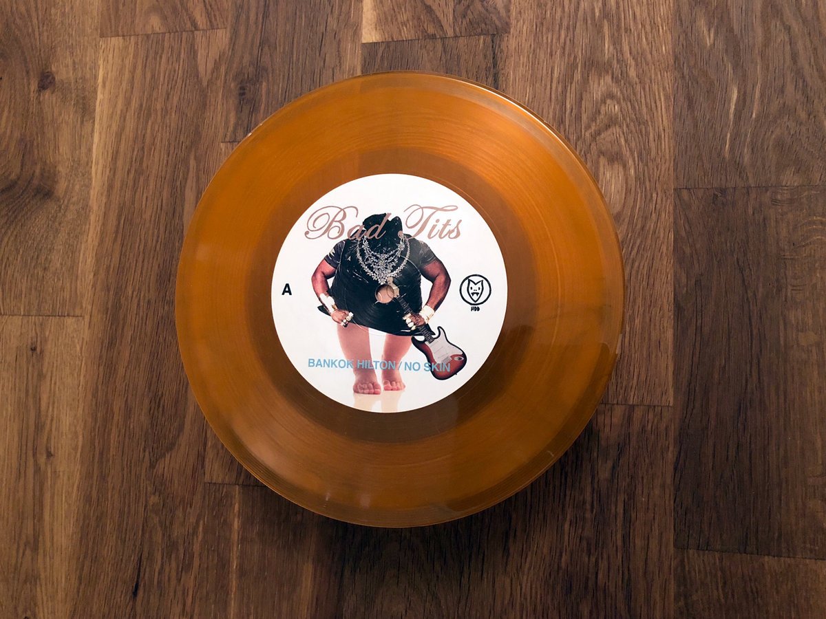 Bad Tits / Garbage Night (EP) - Translucent Orange 7" Vinyl - www.Shopthatapp.com
