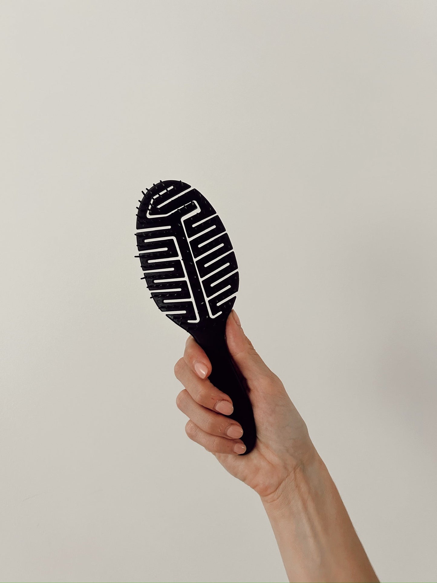 La brosse à cheveux mouillés rose