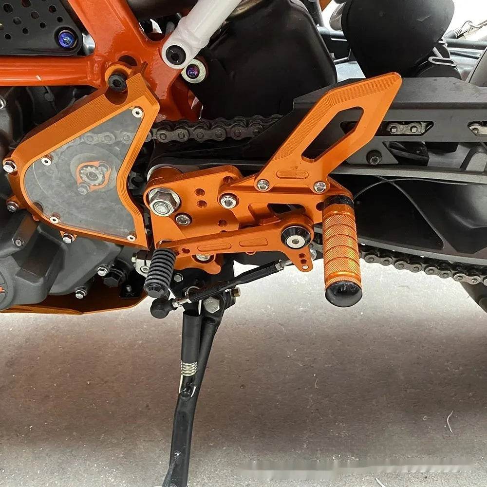 KTMDUKE 125200250390 Foot Pedal Bracket Support Assembly - www.Shopthatapp.com