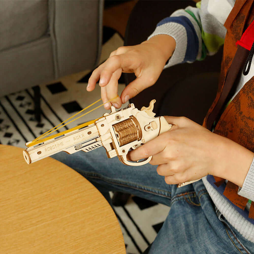 Robotime DIY Rubber Band Bullet Revolver: A Wooden Model Building Kit from Robotime - A Fun and Engaging Assembly Toy Gift for Children and Adults - www.Shopthatapp.com #