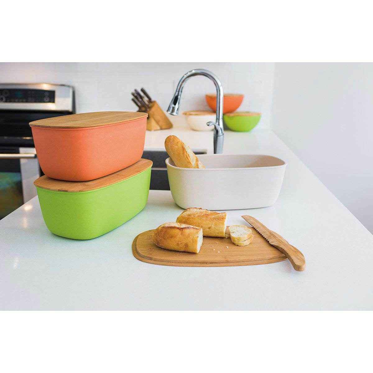 Colorful Peterson Housewares bamboo bread bin with a loaf of bread and cutting board on a kitchen countertop