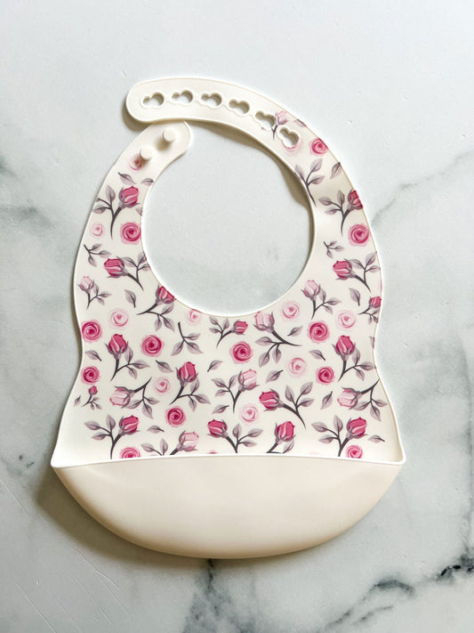 Bavette en silicone avec motifs fleurs - www.Shopthatapp.com
