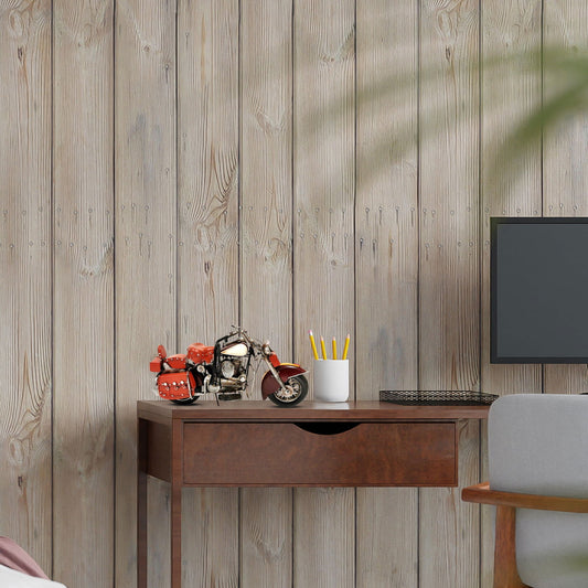 Burgundy motorcycle model displayed on a wooden desk with a modern computer setup