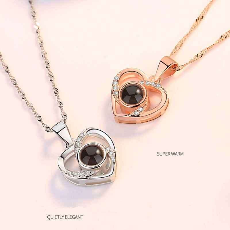 Elegant custom pet necklace featuring heart-shaped pendants in silver and rose gold with sparkling accents