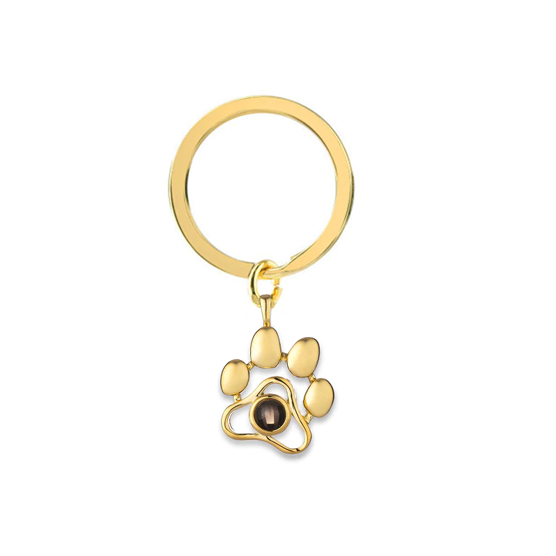 Custom pet photo keychain featuring a golden paw design for pet lovers