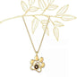 Gold paw print necklace featuring a custom pet photo necklace design with a gemstone centerpiece