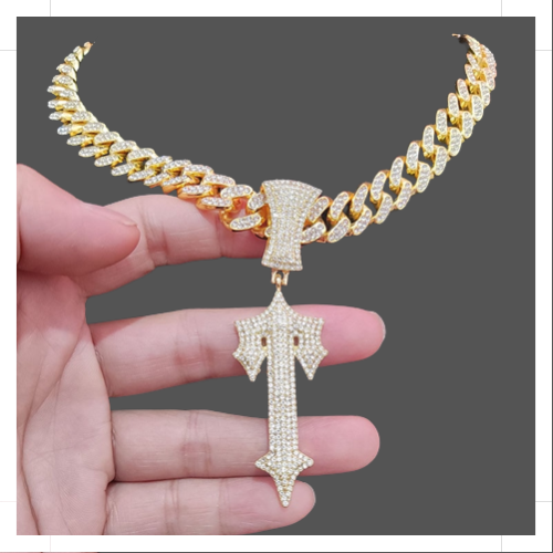 Elegant designer gold jewelry necklace with a unique pendant, crafted by Lost and Found Jewelers