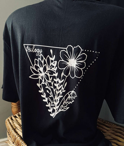 Black floral t-shirt Canada featuring a stylish white floral print design