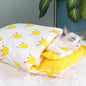 Cozy futon style pet bed in yellow with crown pattern, perfect for cats to relax and sleep comfortably