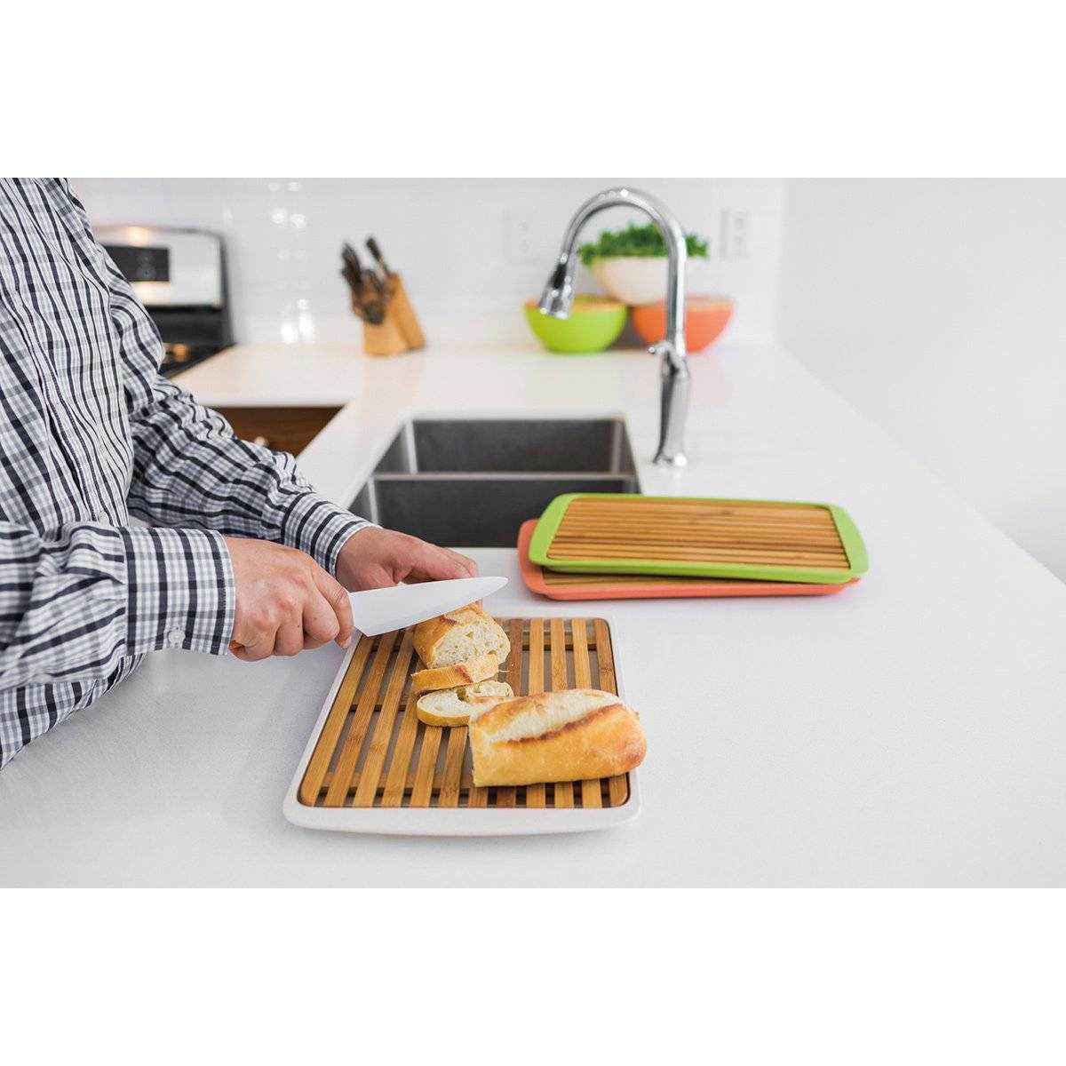 Large bamboo serving board with sliced bread, perfect for entertaining and serving appetizers