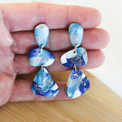 Alma Rosa Jewelry polymer clay stone earrings in blue and white with gold accents