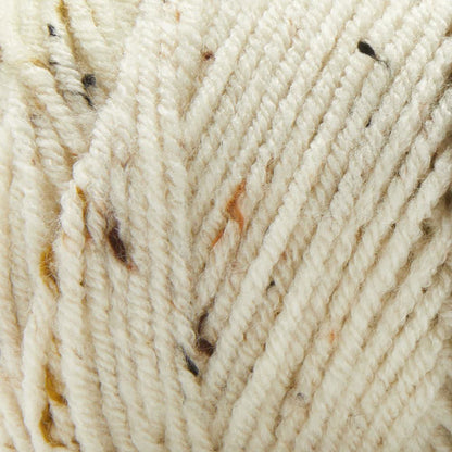 Basix Tweed Yarn Canada in a soft cream color with colorful flecks for crocheting and knitting projects