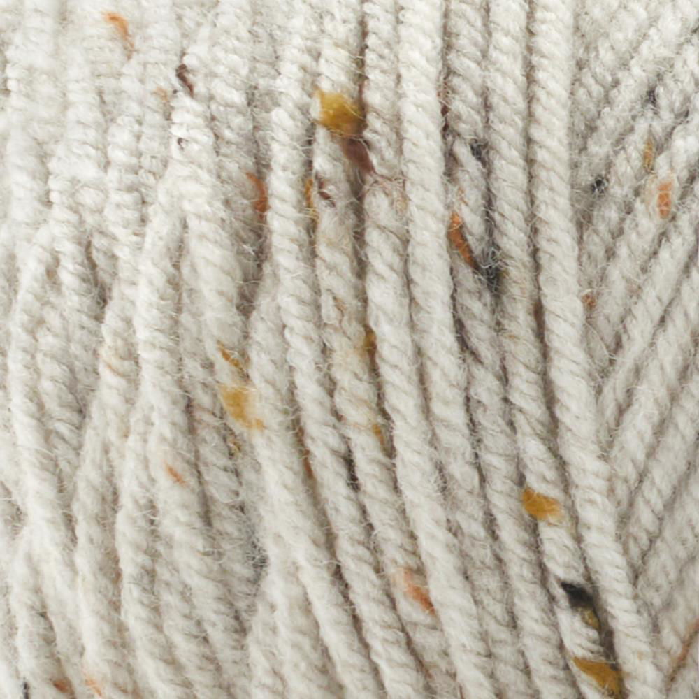 Close-up of Basix Tweed Yarn Canada featuring a soft blend of cream and brown flecks for crochet projects