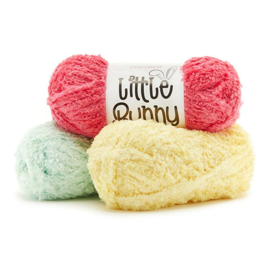 Soft and fluffy Little Bunny yarn in pink, mint green, and yellow, perfect for children's projects. Buy yarn online.