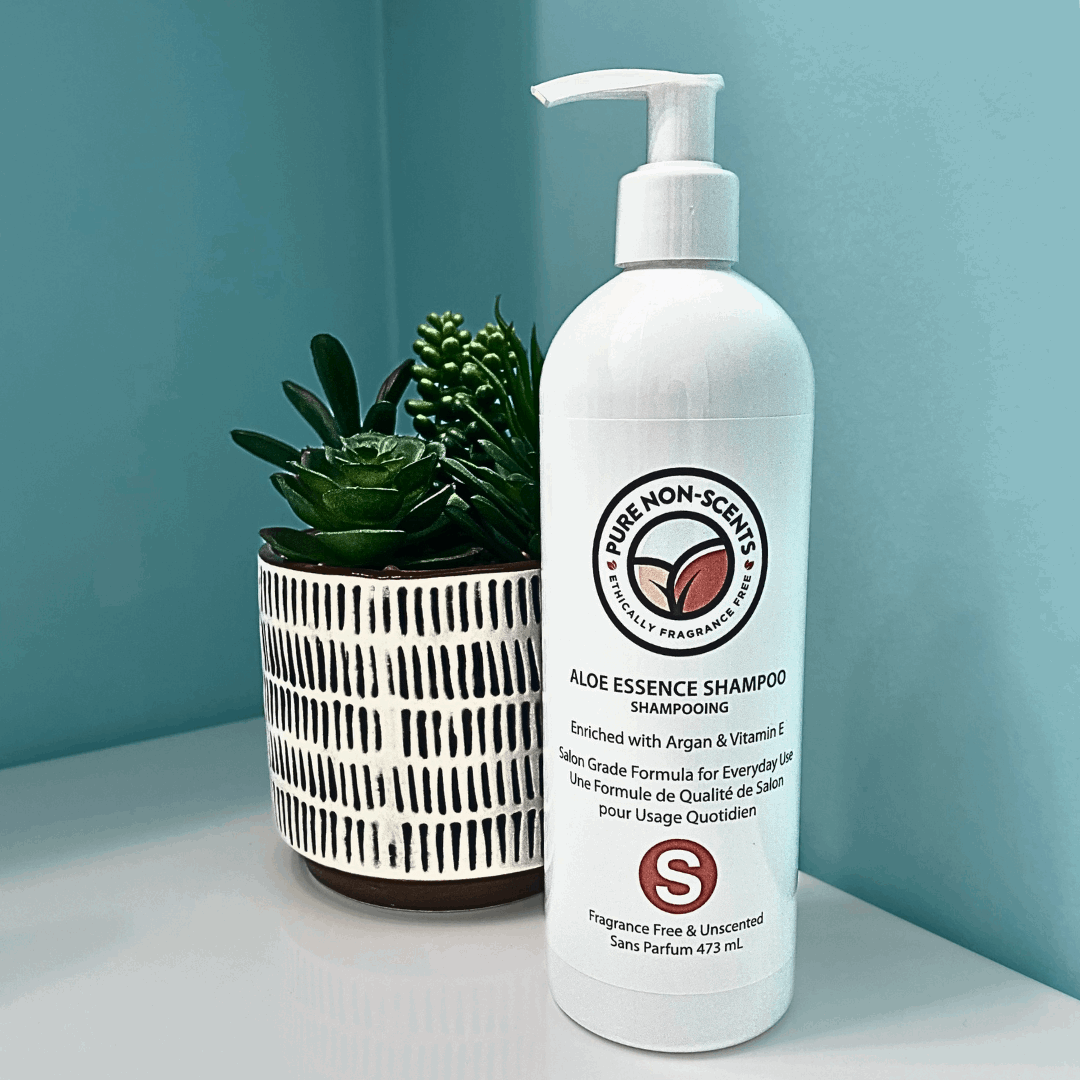 Aloe Essence Shampoo with Vitamin E from Pure Non-Scents in a stylish bottle on a bathroom shelf