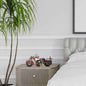 Decorative red motorcycle model displayed on a nightstand in a modern bedroom setting