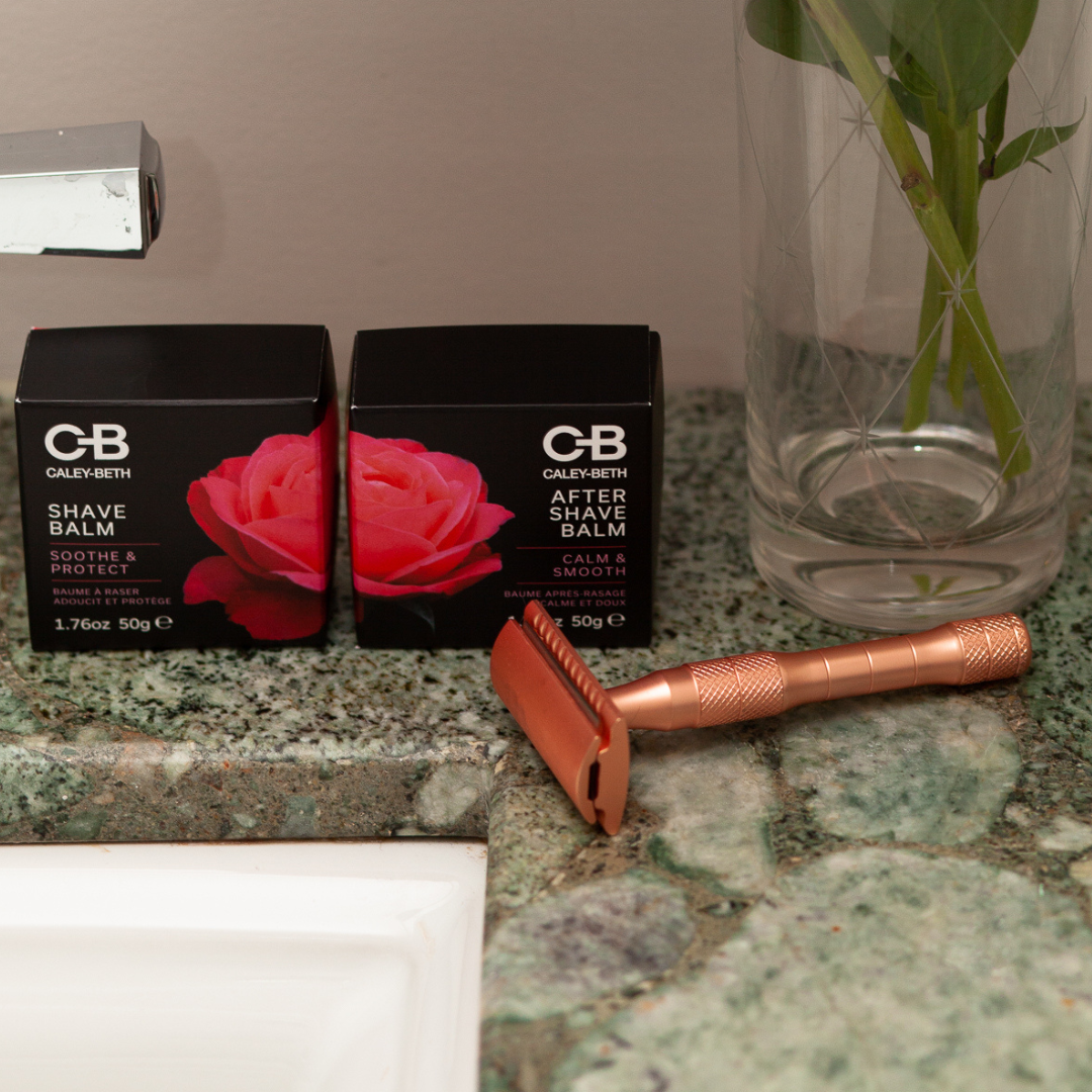 Caley-Beth after shave balm alongside a safety razor for men on a marble countertop
