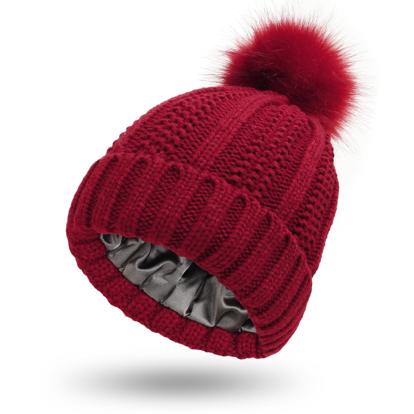 Bonnet en laine doublé de satin avec pompon en fausse fourrure