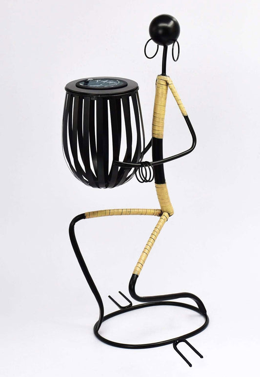 Abstract tribal lady sculpture made of metal with a decorative basket for home decor
