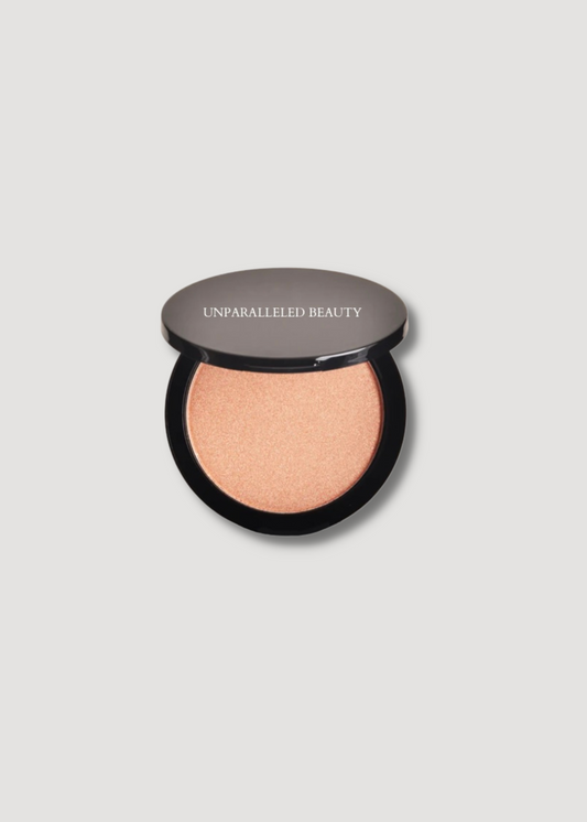 UNPARALLELED BEAUTY natural glow highlighter in a compact for a radiant finish