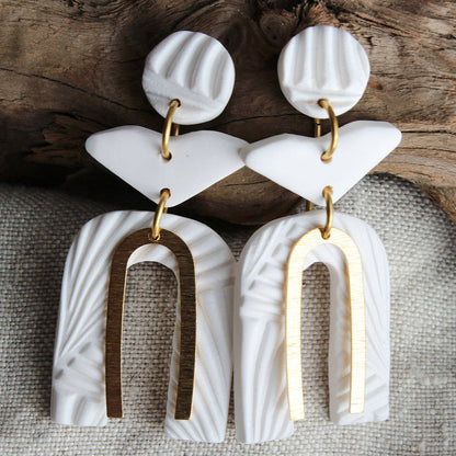 Stylish white polymer clay earrings with unique geometric shapes and gold accents by Alma Rosa Jewelry