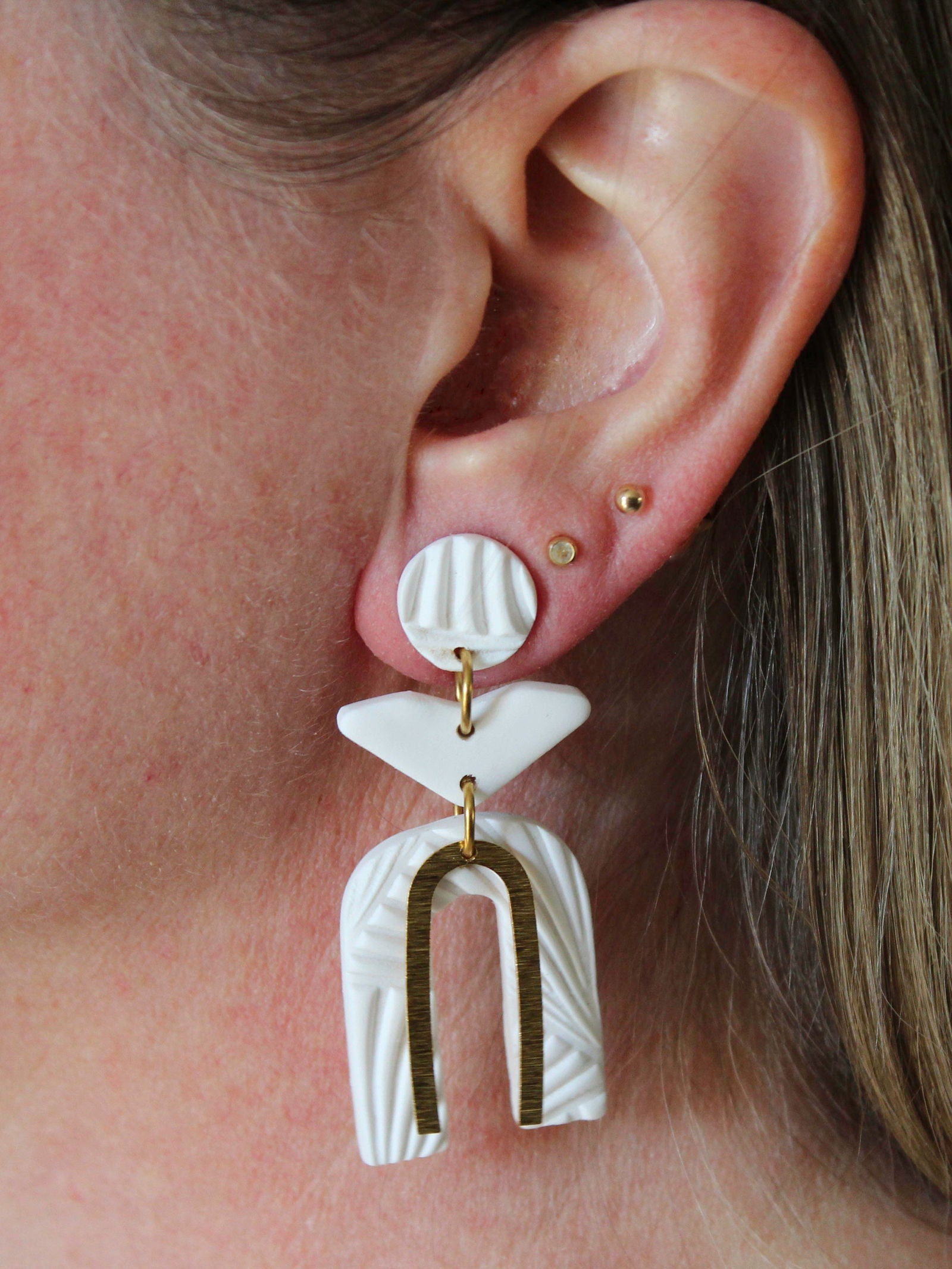 Alma Rosa Jewelry white polymer clay earrings with unique shapes and gold accents for stylish looks