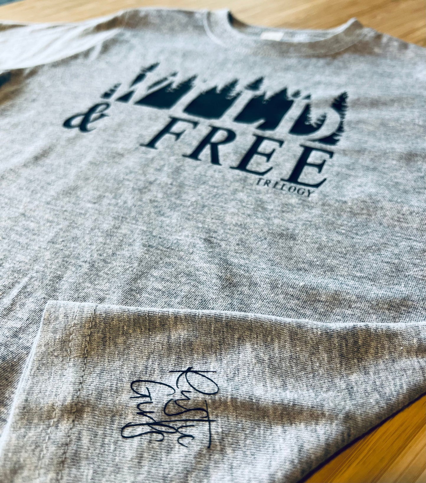 Gray Wild and Free kids t-shirt featuring stylish design and soft fabric for comfortable wear
